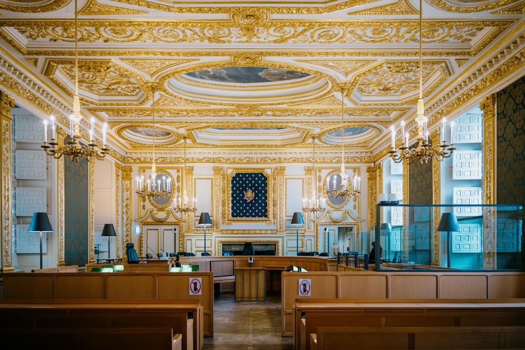 ADA updates. Ornate courtroom with gilded decorations and chandeliers